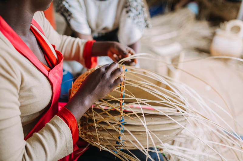 woman-weaving-basket-rwanda-africa