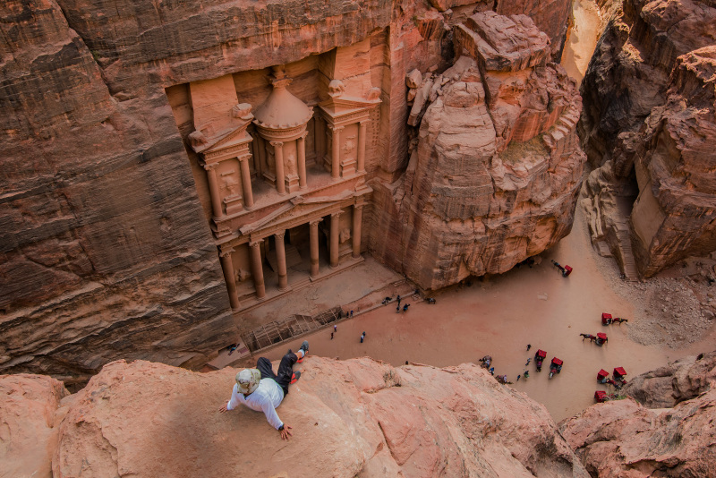 People walking on brown rocky mountain during daytime Jordan