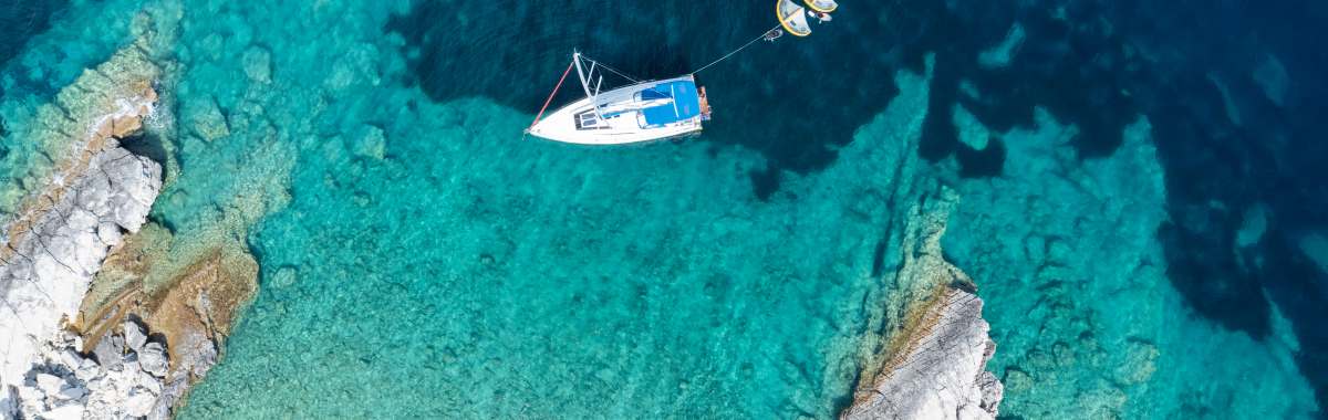 monohull on blue ocean in Corfu