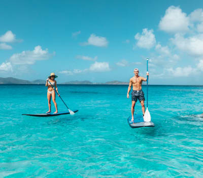 Couple paddleboarding in the BVI