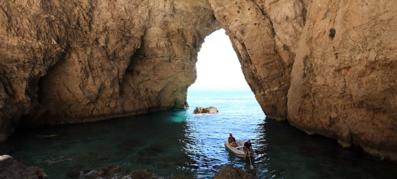 Couple exploring water cave