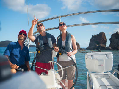 couple sailing Norman Island with crew