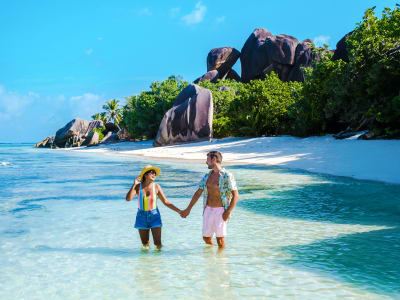 Couple in the water on a beach in Seychelles