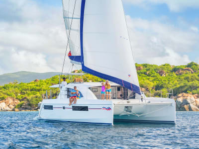 family on sailing catamaran in the BVI