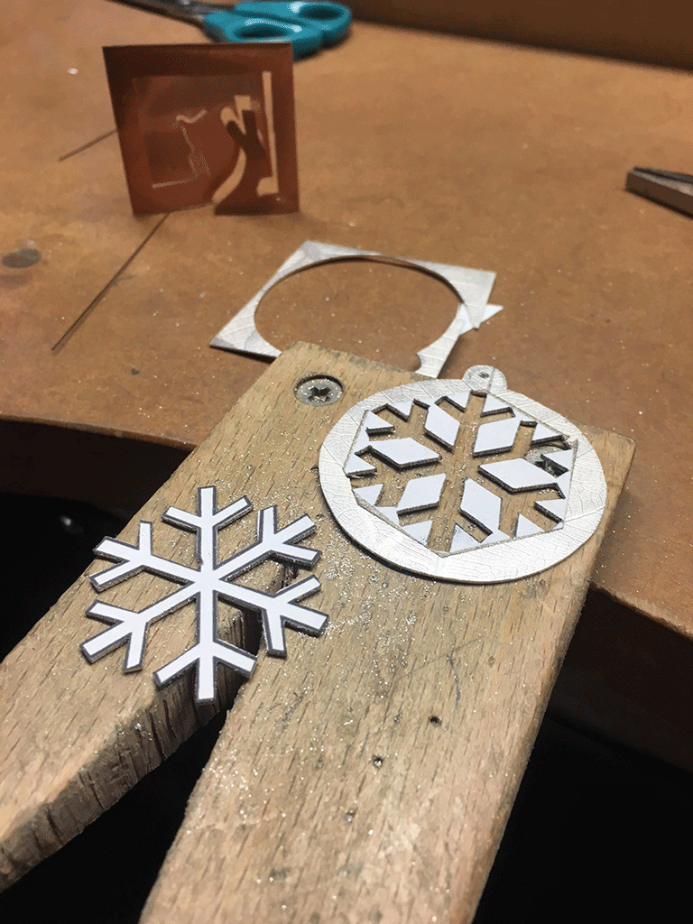 Both decorations cut out of single 5cm square sheet ready for finishing