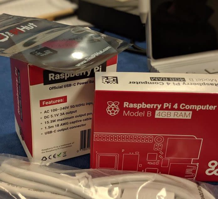 Image showing a boxed Raspberry Pi 4 Computer Model B, 4GB Ram, and power cables