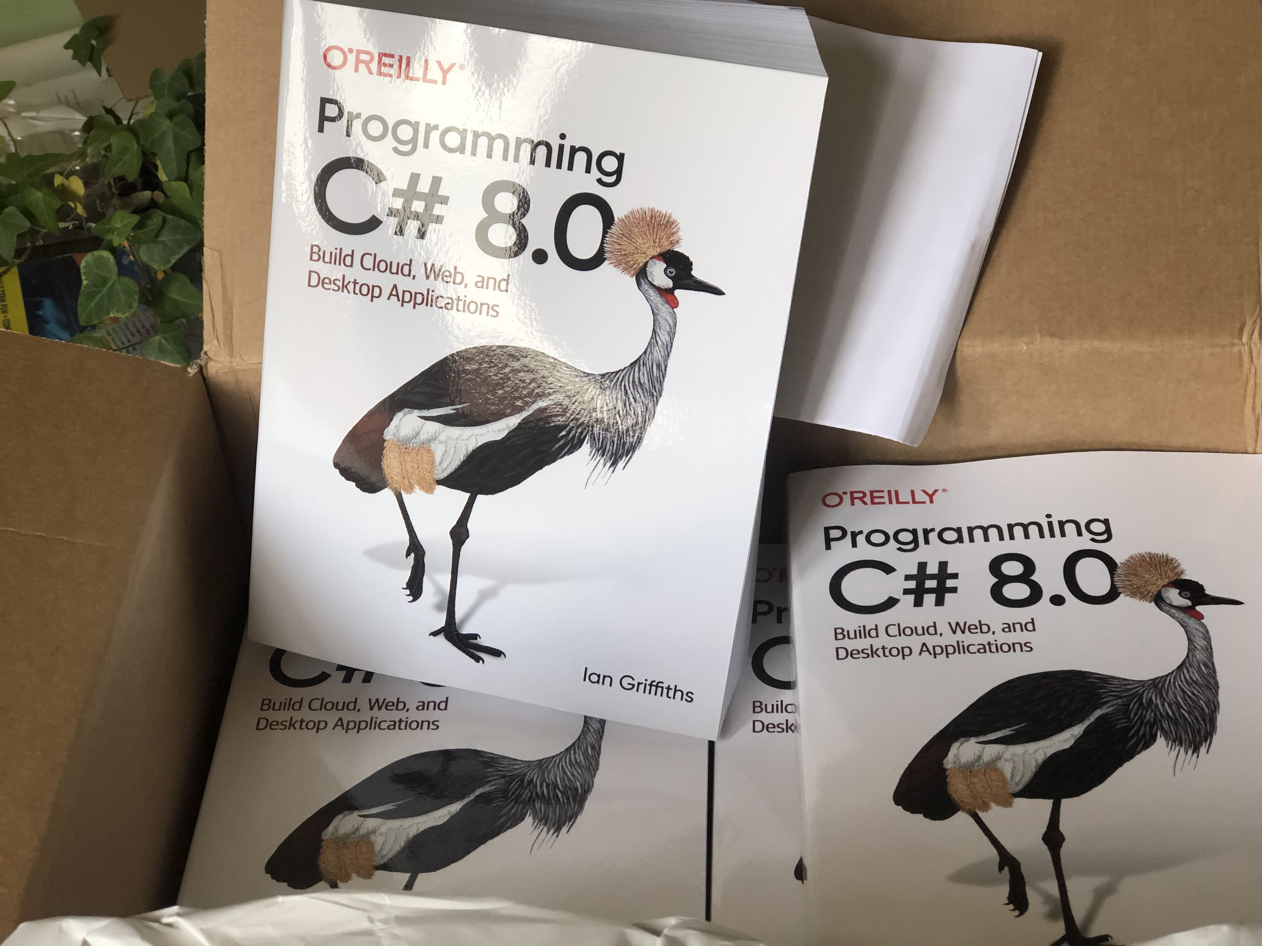 A box full of copies of Programming C# 8.0