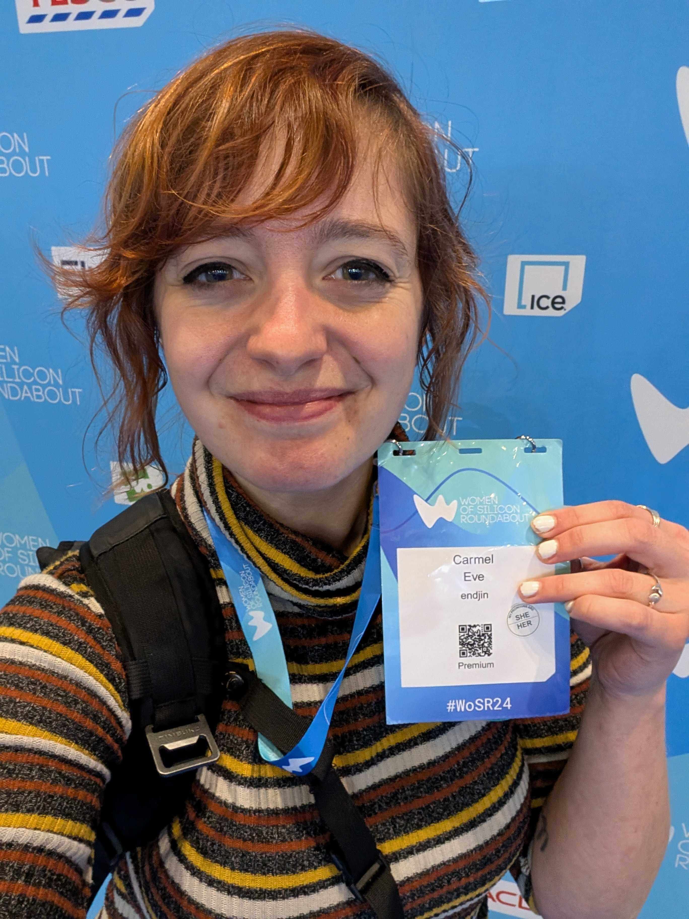 A photo of me at WOSR, holding my pass.