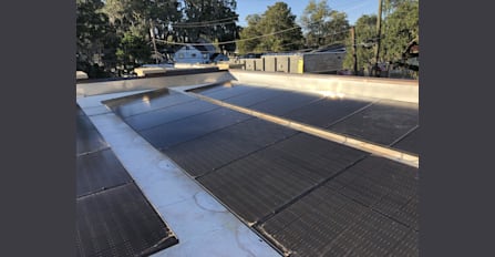 Solar installed on a flat roof of a very unique building