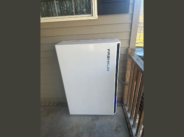 Keeping those assets covered: A Franklin WH battery on  on a cement porch for client to enjoy energy independence when they need to.