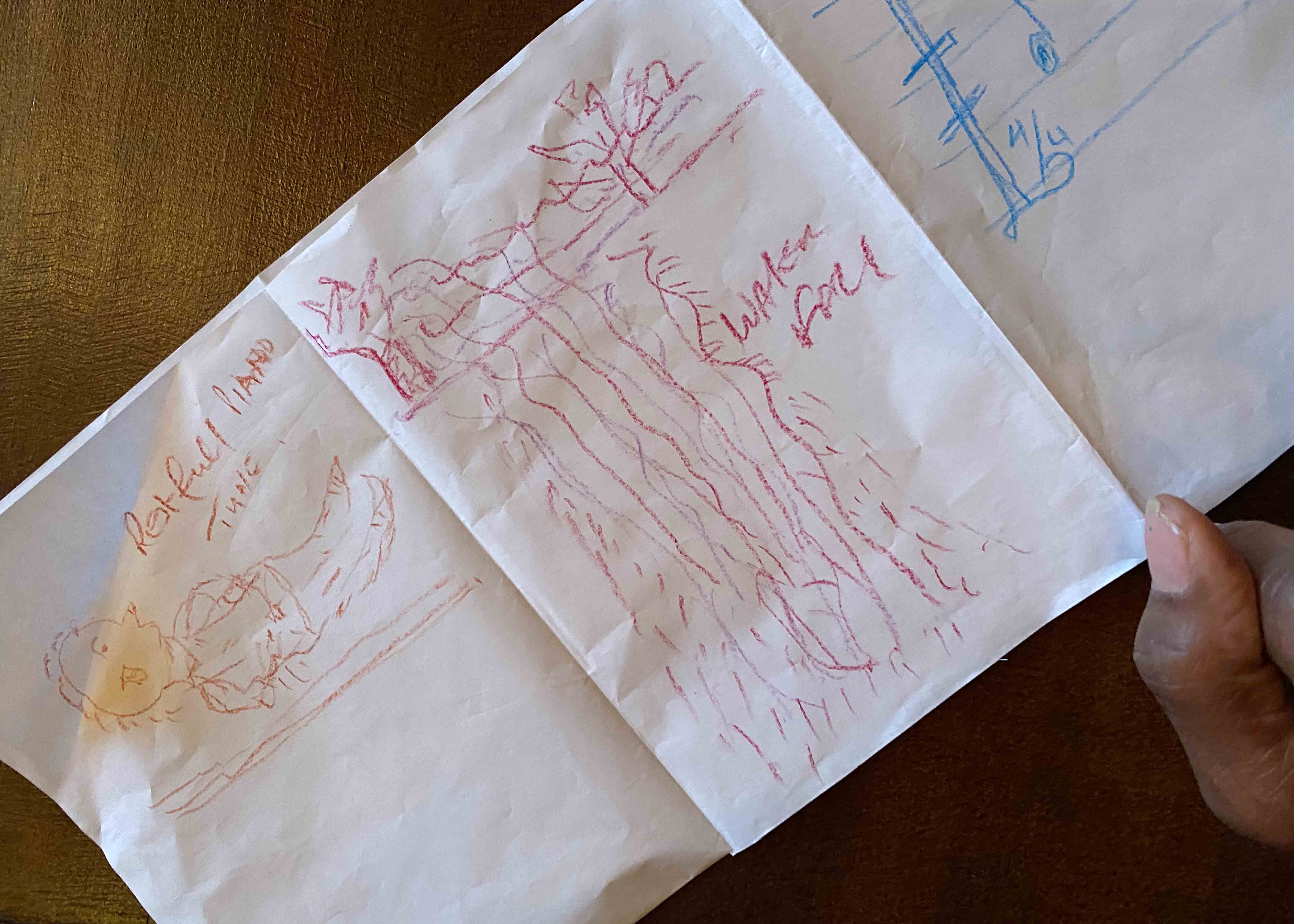 Detail of drawings on a folded piece of paper
