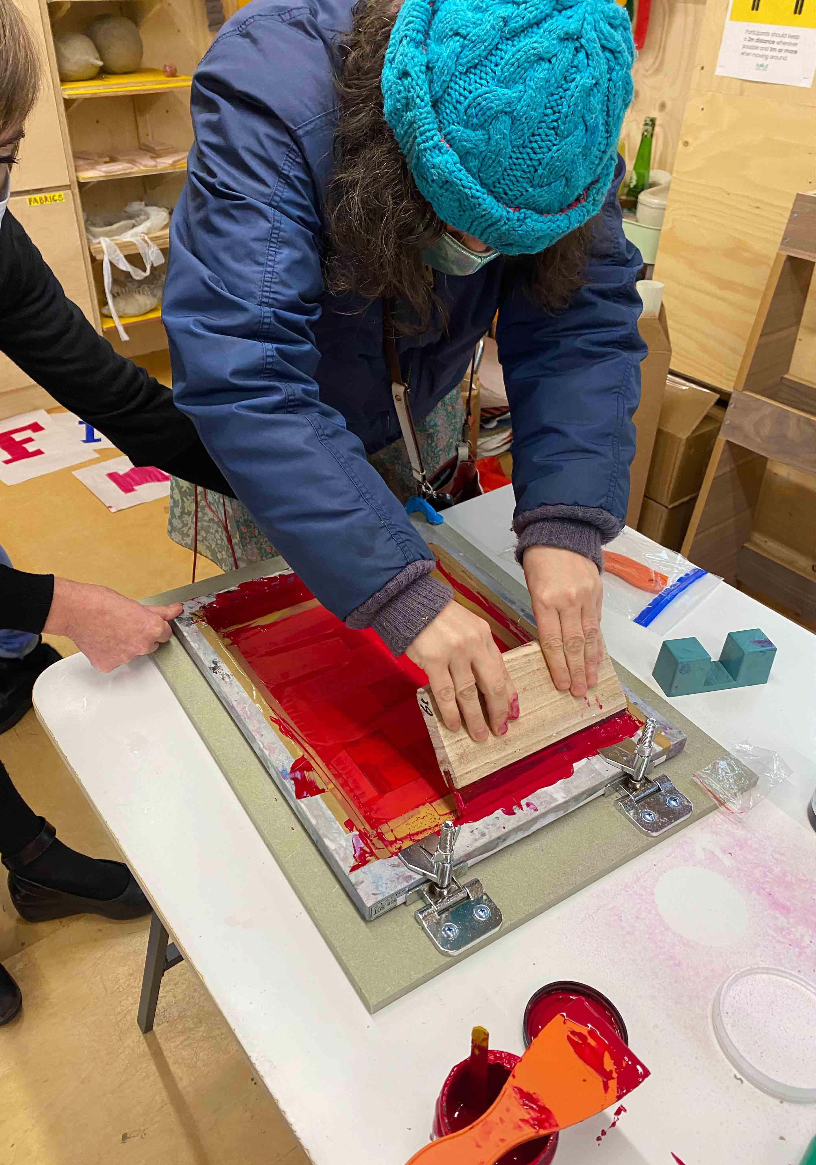 Woman screenprinting