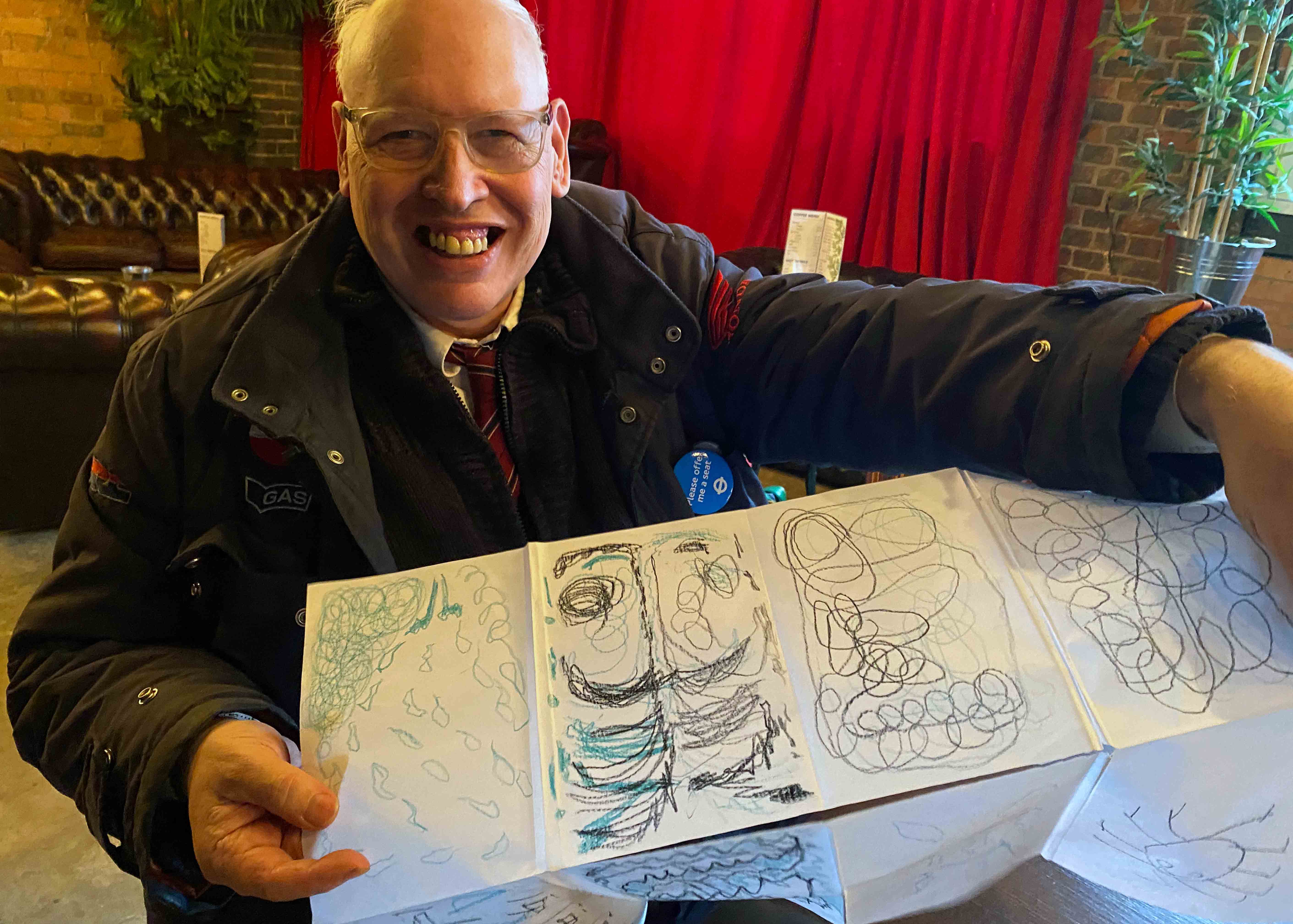 Man holding a drawing