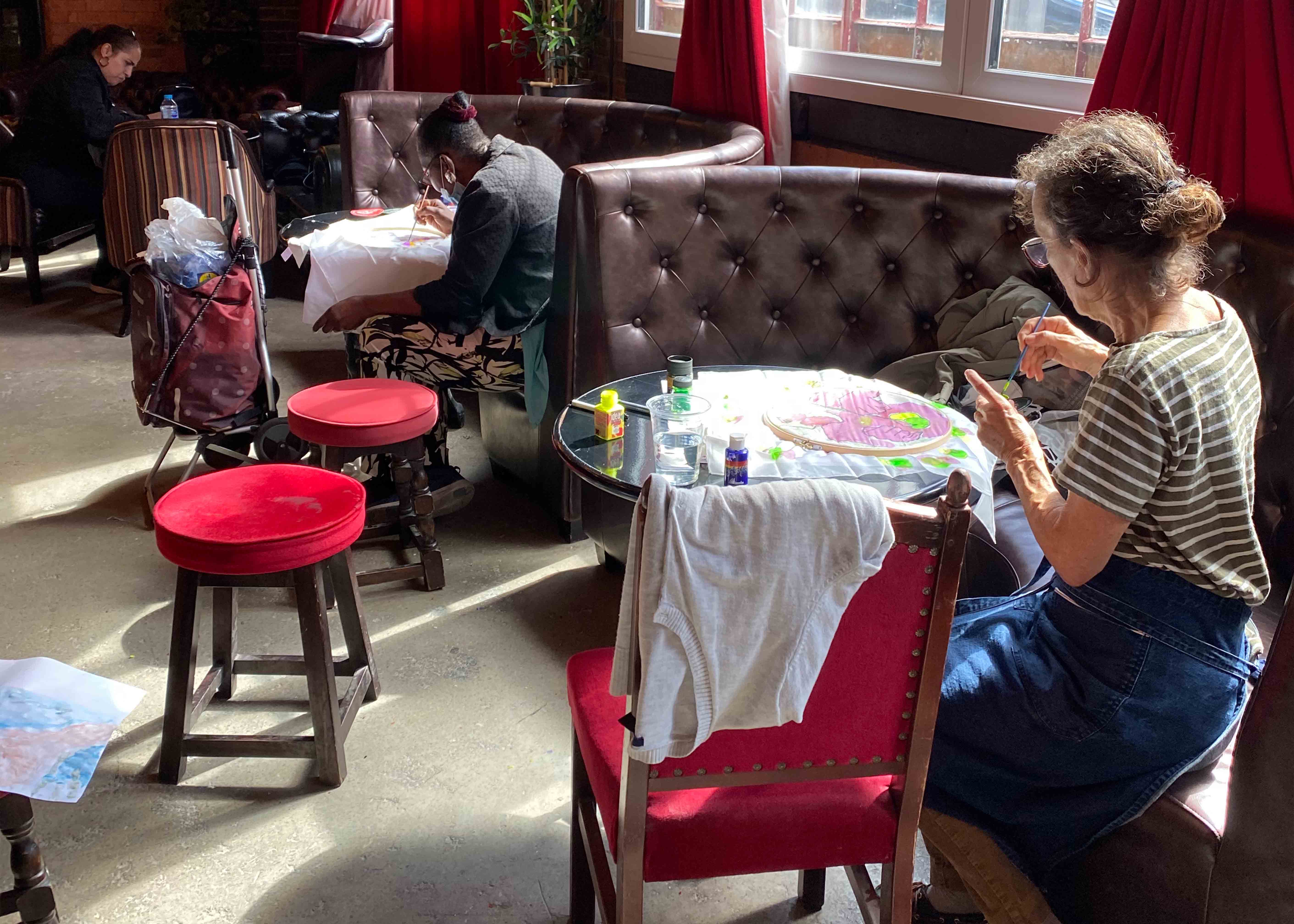 People painting in a pub