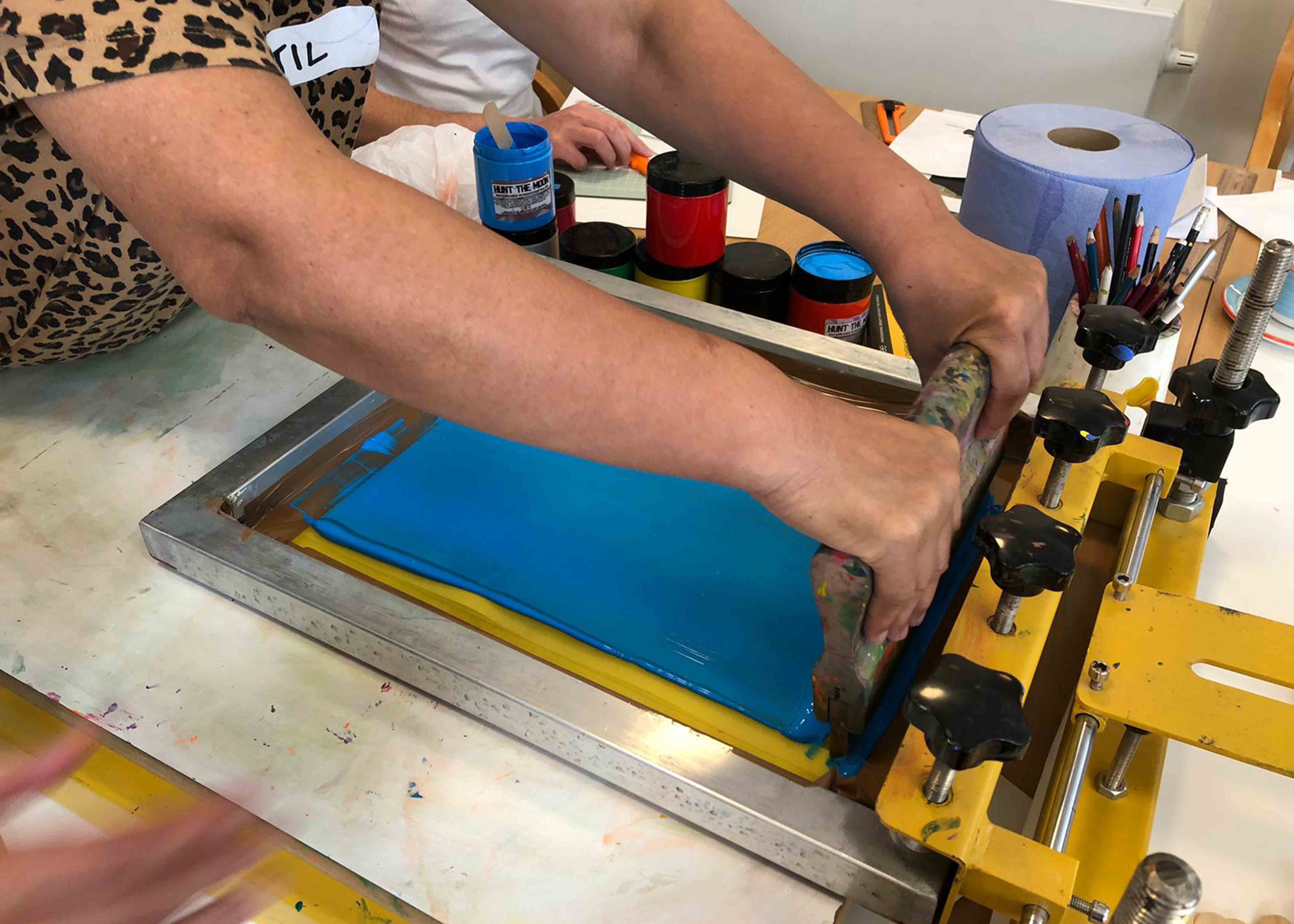 woman screen printing