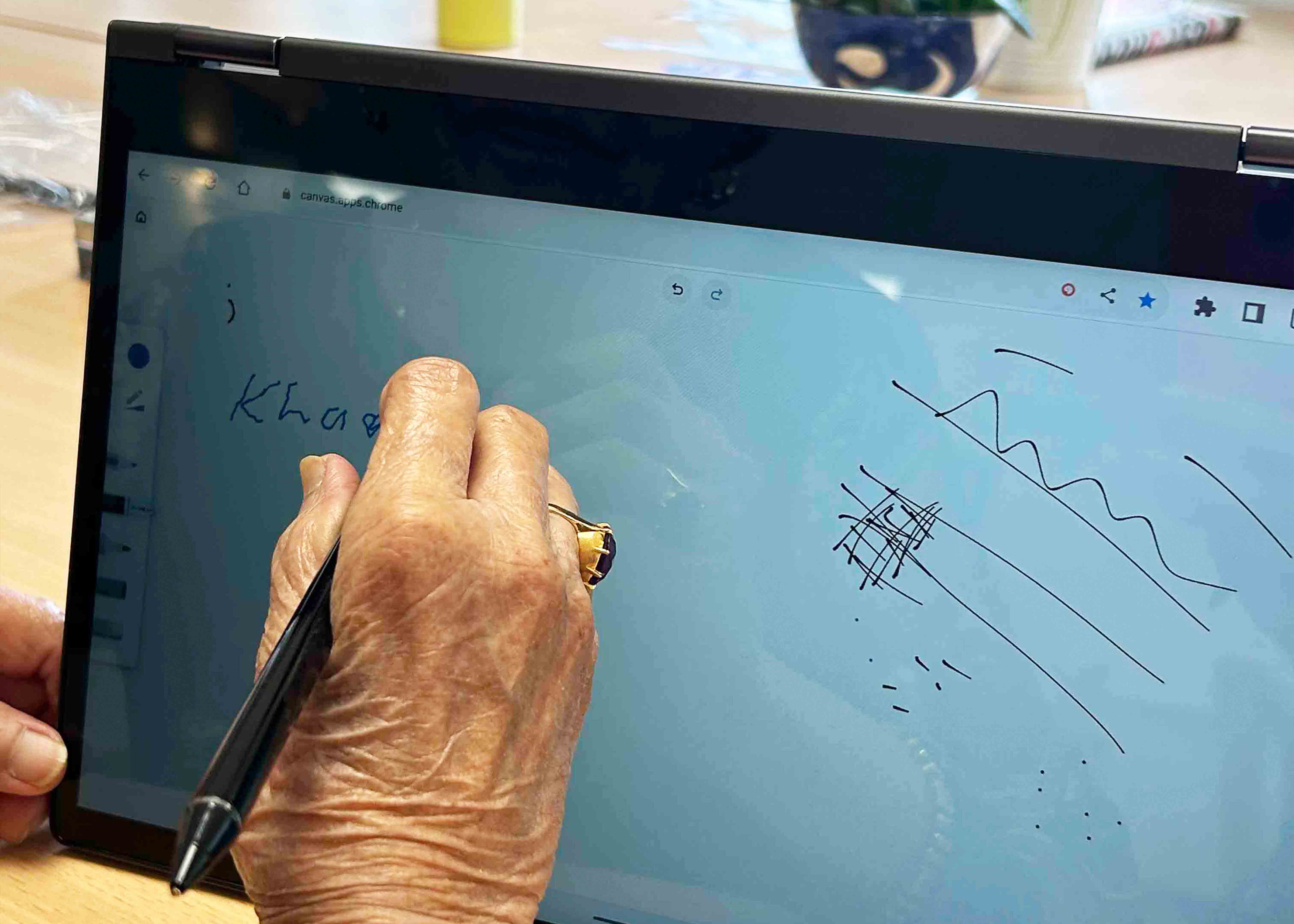 person drawing on tablet