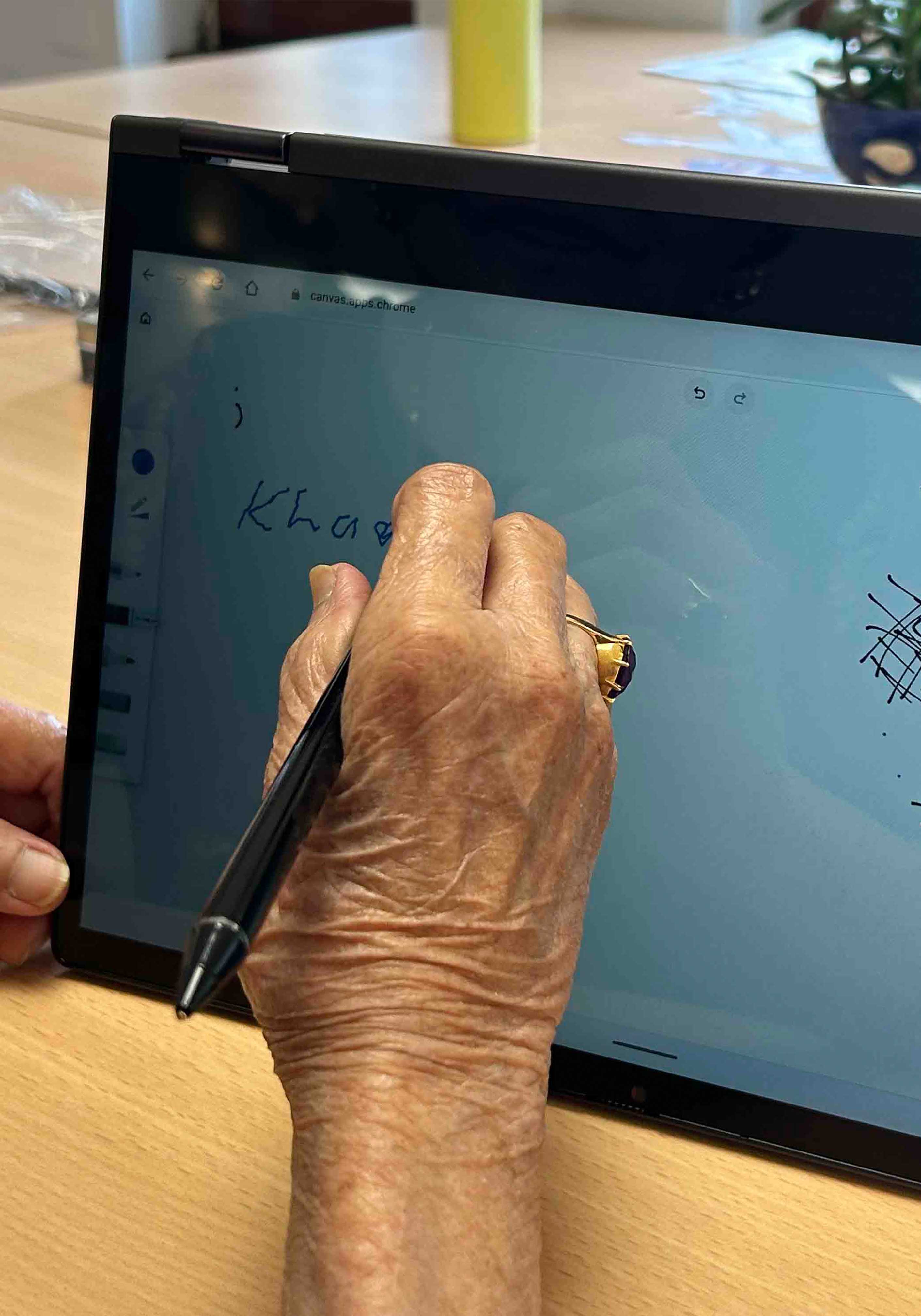 person drawing on a tablet