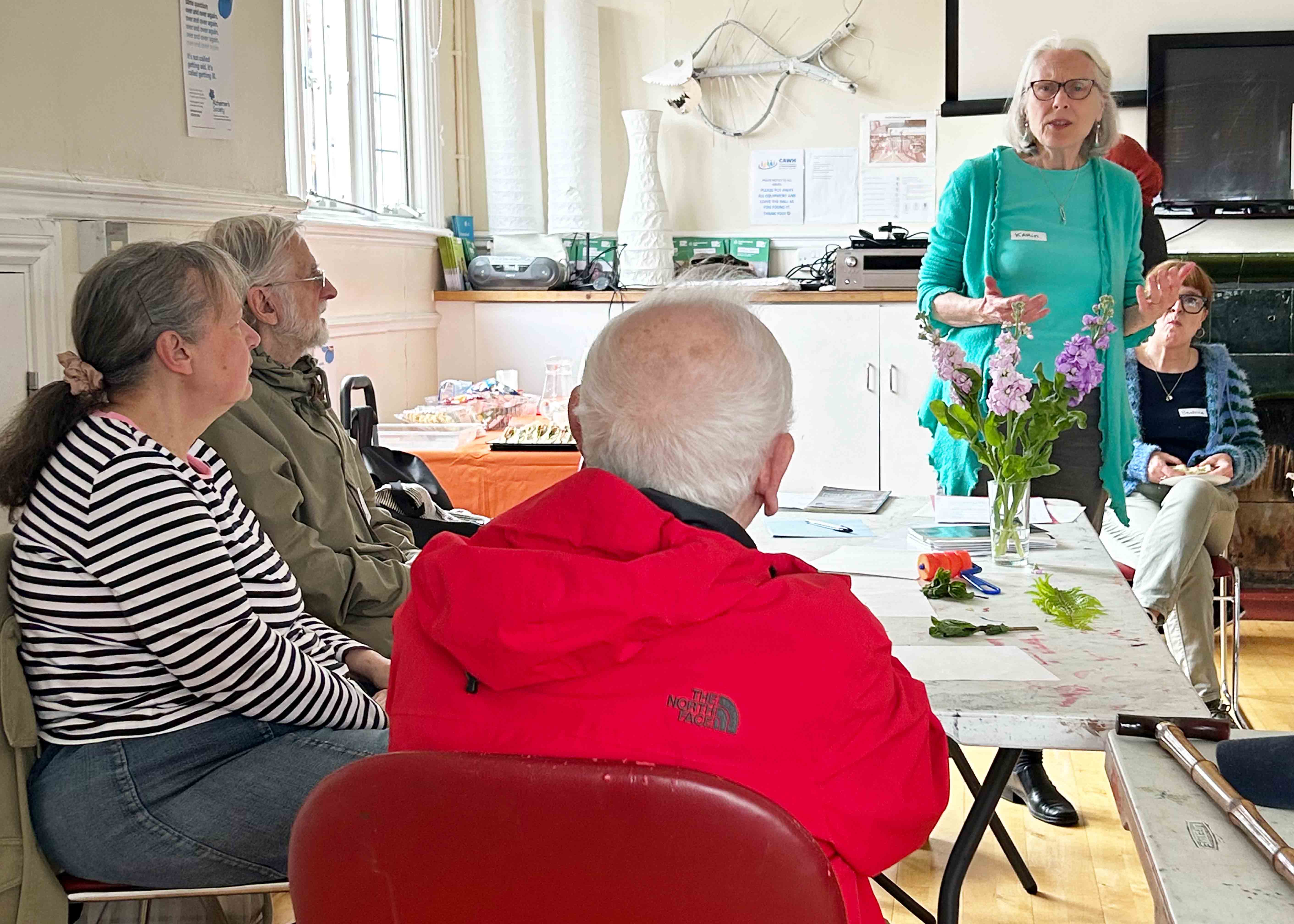 Karin De Novellis addressing a group of people