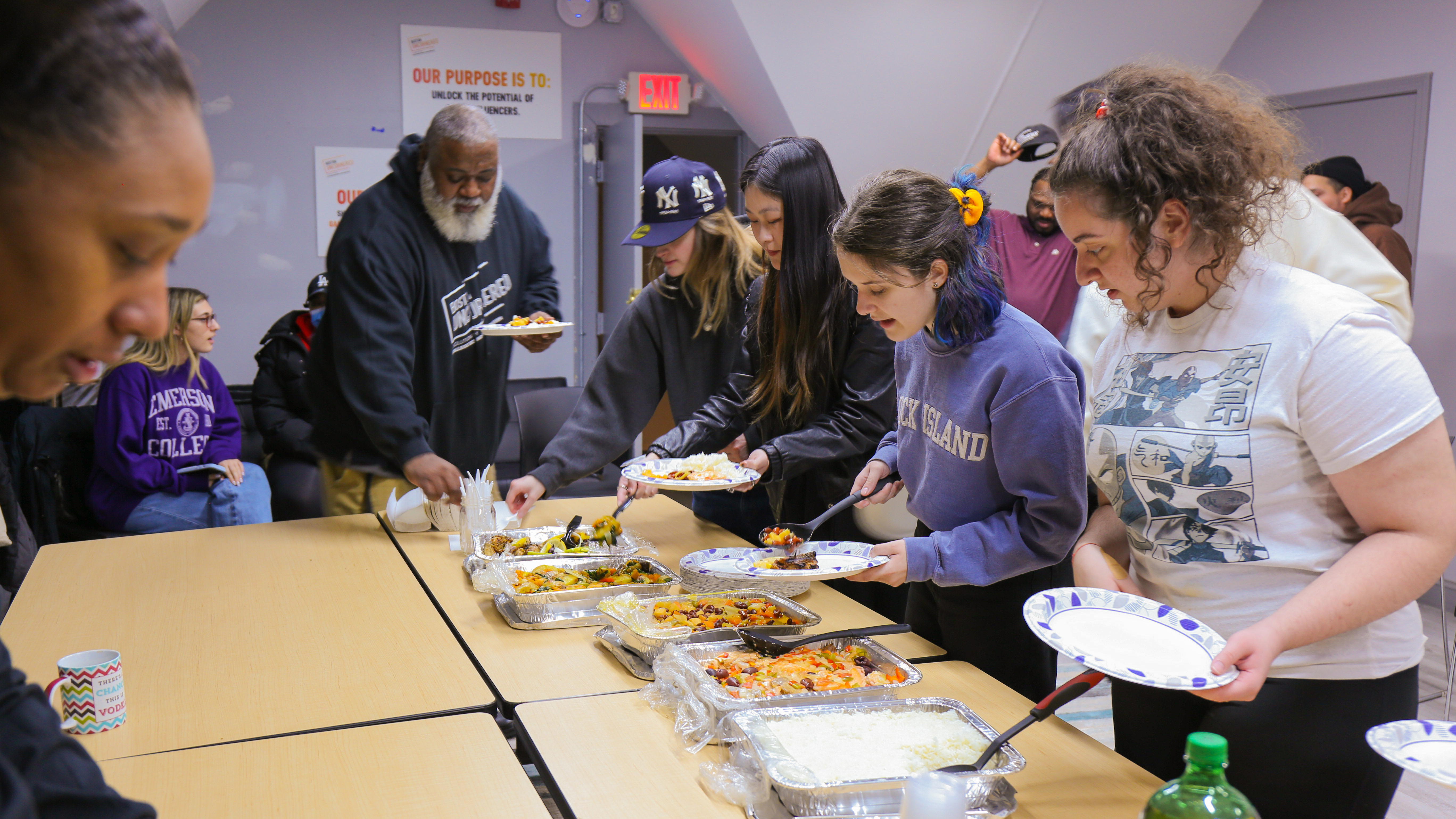 Emerson students and learning partners sharing a meal at Boston Uncornered