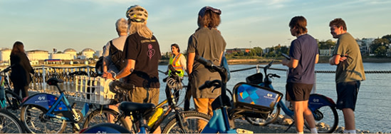 Emerson students on bikes near the water