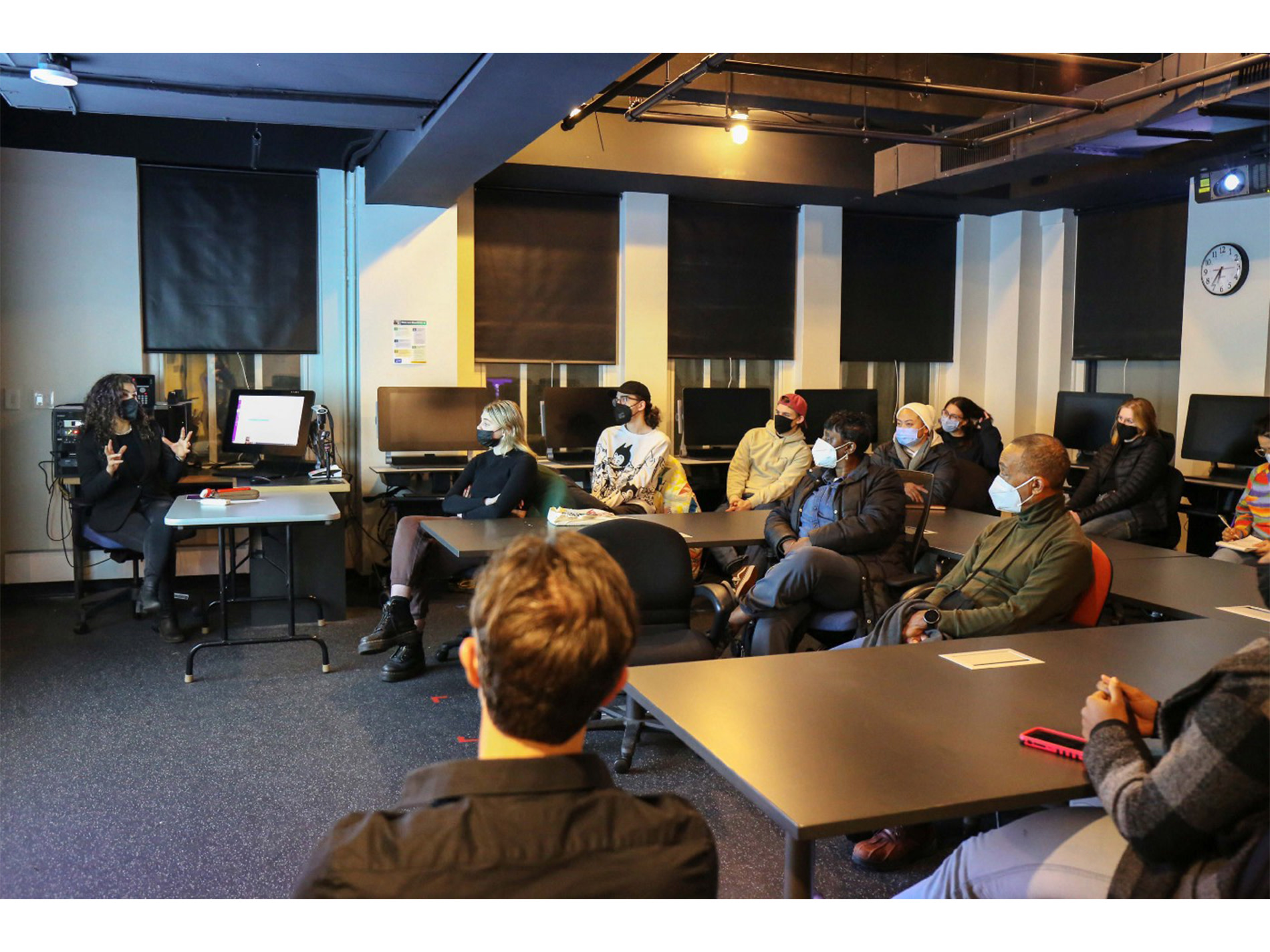 Candid photo of class participants involved in discussion.