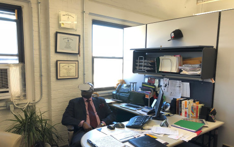 Photo of Kevin Sibley, former Director of the City of Boston‘s Mayor’s Office of Returning Citizens, watching a video.