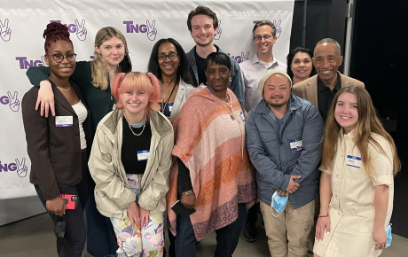 Group photo of studio participants in front of TNGV logos