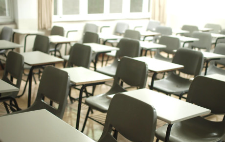 Rows of student desks in a classroom.