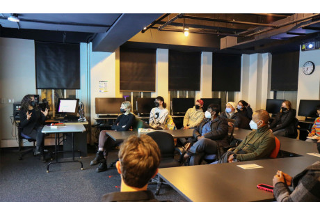 Candid photo of class participants involved in discussion.