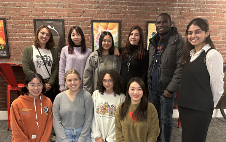 Members of the Media Design 2022 Cohort posing in front of a brick wall