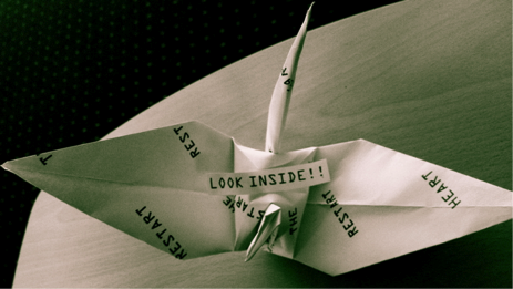 Figure 7 Photo: Glenda Caldwell. A paper crane with a QR code inside