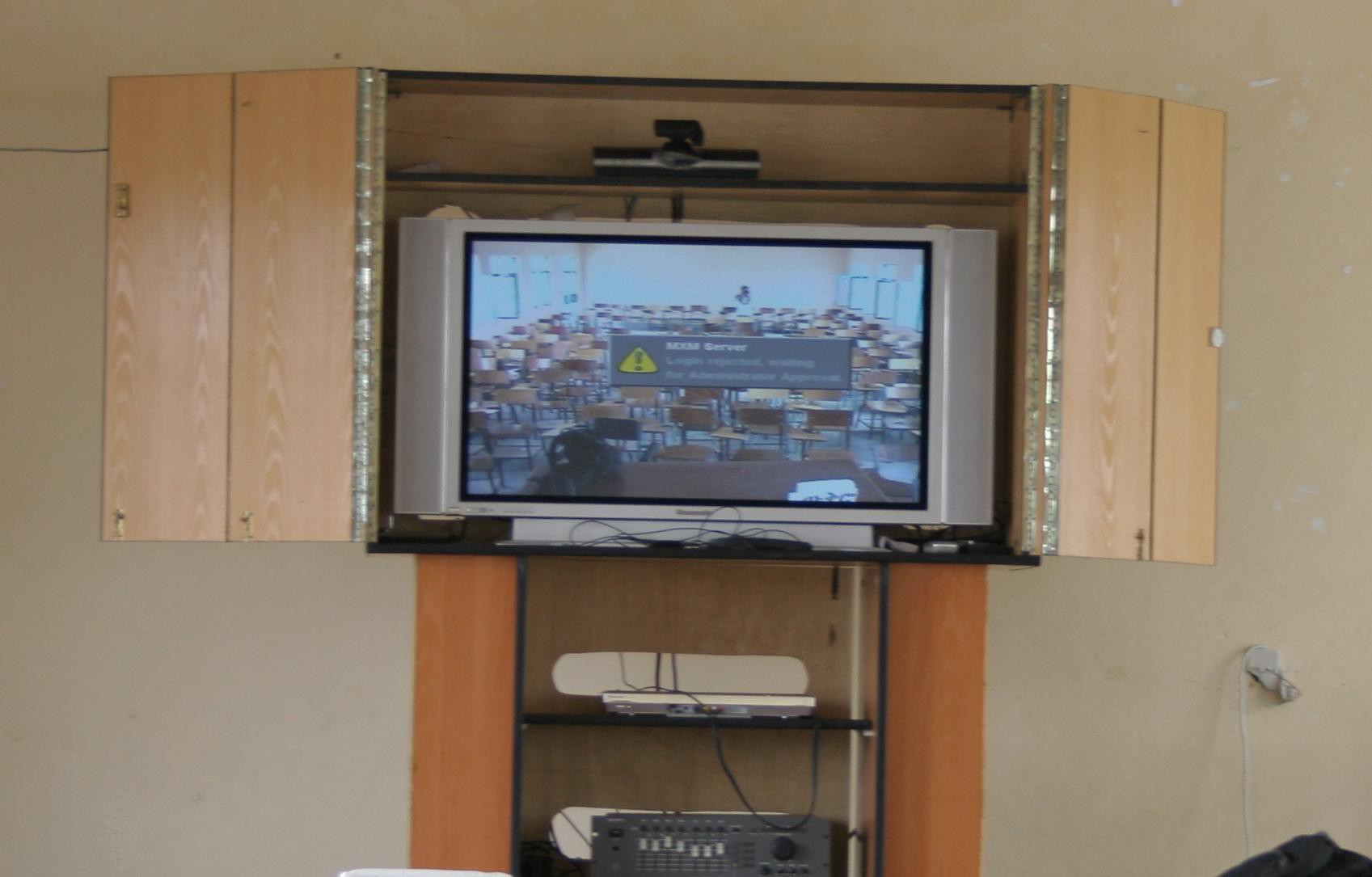 Fig. 1 The Woredanet equipment, composed of, from top to bottom, a video-camera, a plasma TV screen, a decoder, an amplifier/equalizer (© Author)