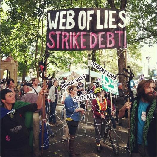 Strike Debt banner at S17 (Photograph by Chase Wilson in Portland, Oregon, September 17, 2012)
