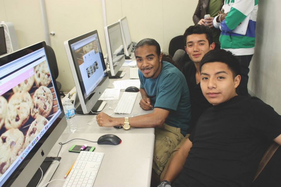 (from left) Teammates Michael Taton, Hector Linares, and Michael Sandoval take a quick break from coding the website for Shaquann’s Gourmet Cookies in order to smile for the camera | Photo: J. Morr