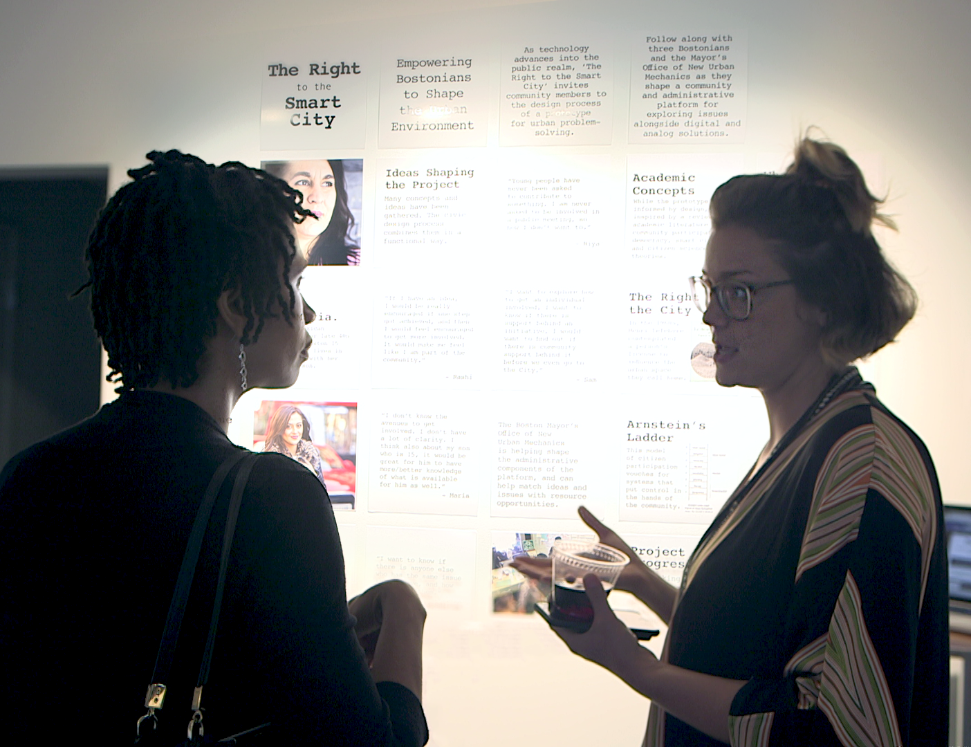 Lauren Stott talks about her CMAP thesis project, which is outlined on the wall behind her.