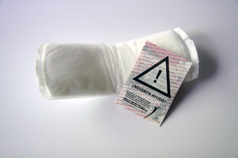 Figure 1: Anti-human trafficking messaging, printed on water-soluble paper and inserted into generic sanitary pad packaging.