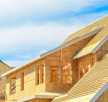 Street view of a home under construction.