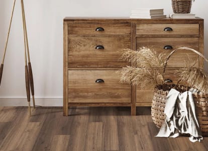 A chest, lamp, and basket on EF hard surface flooring