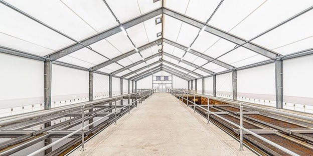 Constructing Fabric Buildings with Solid Steel Frames