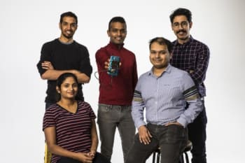 The University of Washington engineers behind the wireless charging system for mobile devices. Standing (left-to-right): Vikram Iyer, Shyam Gollakota, Elyas Bayati. Seated (left-to-right): Rajalakshmi Nandakumar, Arka Majumdar. (Image courtesy of Mark Stone/University of Washington.)