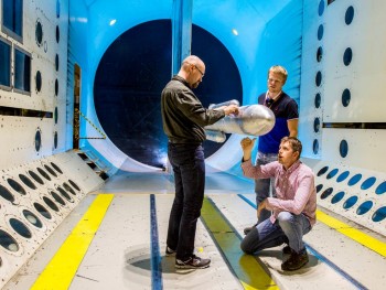 NASA engineers ready their SLS model for critical wind tunnel tests. (Image courtesy of NASA.)