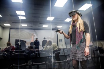The HMD suite is separated from the auditorium by an electrostatic glass wall. Spectators in the auditorium have access to stereo glasses for review or participation. (Image courtesy of Virtalis.)