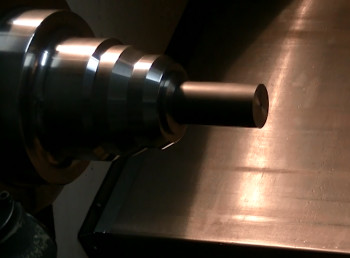 Figure 2. Mild steel part being held in a collet chuck prior to the peck drilling cycle. (Image courtesy of Otterview Machine.)