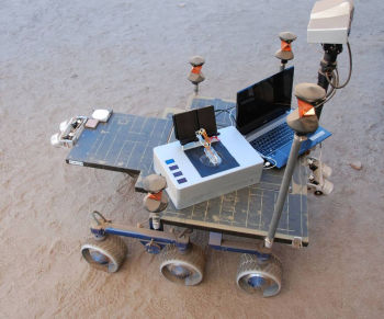 Researchers took the Chemical Laptop to JPL's Mars Yard, where they placed the device on a test rover. This image shows the size comparison between the Chemical Laptop and a regular laptop.(Image courtesy of NASA/JPL-Caltech.)