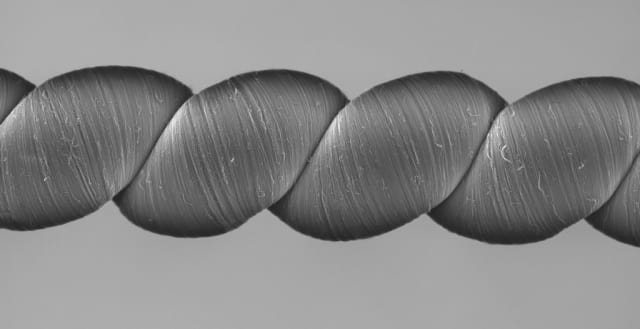 Coiled carbon nanotube yarns, created at the University of Texas at Dallas and imaged here with a scanning electron microscope, generate electrical energy when stretched or twisted. (Image courtesy of the University of Texas at Dallas.)