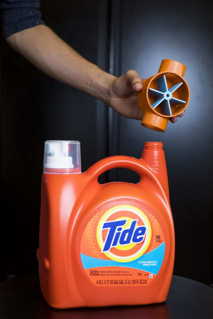UW engineers have developed the first 3-D printed plastic objects that can connect to other devices via WiFi without using any electronics. The 3-D printed attachment above can sense how much laundry soap is being used -- and automatically order more when the bottle is running low. (Image courtesy of Mark Stone/University of Washington.)