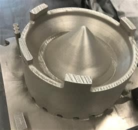 Additively manufactured, cobalt-chrome sump cover for F110 engine. Produced on a GE Additive Concept Laser M2 machine at the GE Additive Technology Center in Cincinnati, as part of collaboration with the US Air Force’s Rapid Sustainment Office (RSO). (Photo courtesy of GE Additive.)