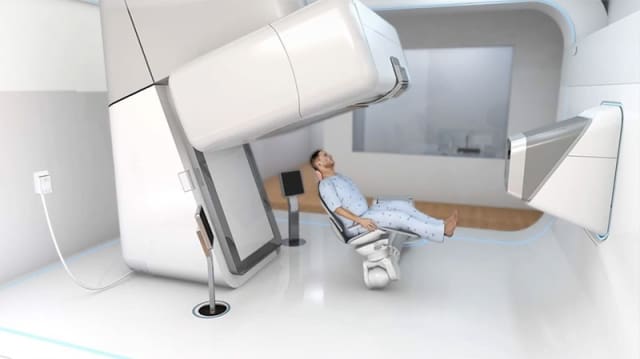 Figure 5 - The patient is precisely positioned with the help of a numerically controlled, 5-axis seat. Not shown is how the patient may be restrained. “The degree of fixation varies,” says Neil Barker of Advanced Oncotherapy.