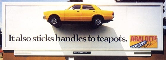 In 1983, the British ad agency FCO Univas showcased the strength of Araldite by gluing a yellow Ford Cortina to a billboard in London. (Image courtesy of Robert Messenger.)