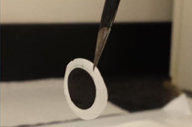 This carbon nanofiber electrode, when coated with ionogel, can eliminate the need for a flammable electrolyte solution in energy storage devices -- making them safer to use. (Image courtesy of Drexel University.)